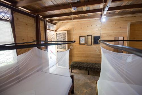 Cama o camas de una habitación en Bella Flor Hostel Palomino