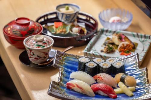 a table with three plates of food on it at Nagoya Marriott Associa Hotel in Nagoya