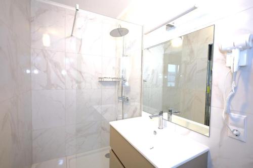 a bathroom with a sink and a shower and a mirror at Valpino 