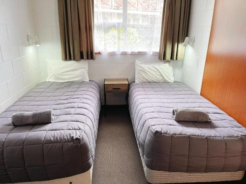 Una cama o camas en una habitación de Cumberland Motel