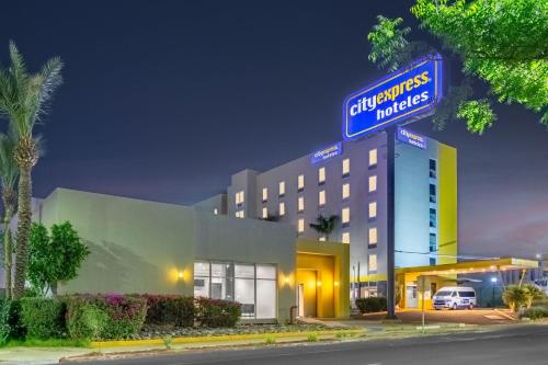 a hotel with a sign on top of it at City Express by Marriott Hermosillo in Hermosillo