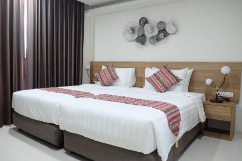 Ένα ή περισσότερα κρεβάτια σε δωμάτιο στο Christella Hotel Laemchabang