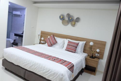 Ένα ή περισσότερα κρεβάτια σε δωμάτιο στο Christella Hotel Laemchabang
