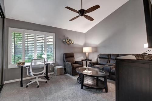 a living room with furniture and a ceiling fan at RC942 - Racquet Retreat - Meredith Lodging in Rancho Mirage