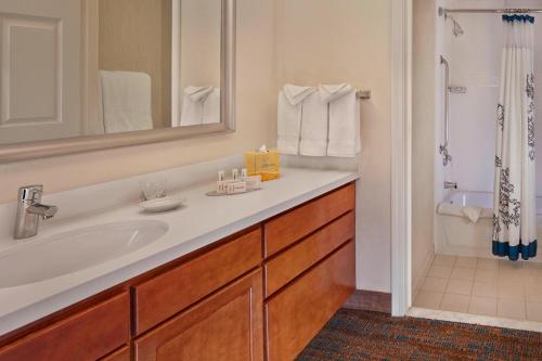 a bathroom with a white sink and a shower at Residence Inn Anaheim Hills Yorba Linda in Anaheim