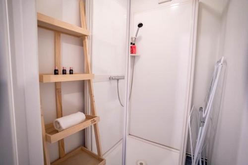 a bathroom with a shower and a glass shower stall at The Green House of Stavanger BnB 14 -Central, Sauna and Airport Shuttle in Stavanger