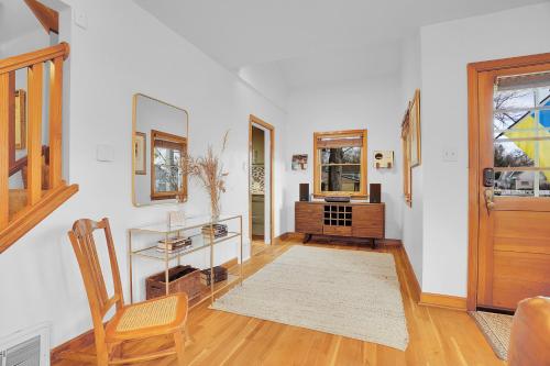 a living room with a chair and a table at Beautiful Historic House in Central Longmont in Longmont