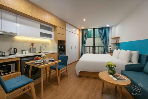 a hotel room with a bed and a kitchen at Westlake Pearl Apartment & Hotel - By Pegasy Group in Hanoi