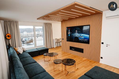 a living room with a couch and a flat screen tv at Albelli Luxury Skyview in Košice