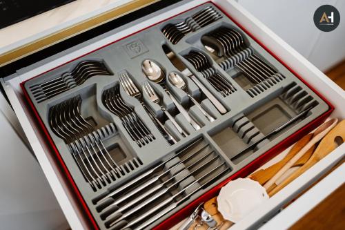 a drawer full of utensils in an appliance at Albelli Luxury Skyview in Košice