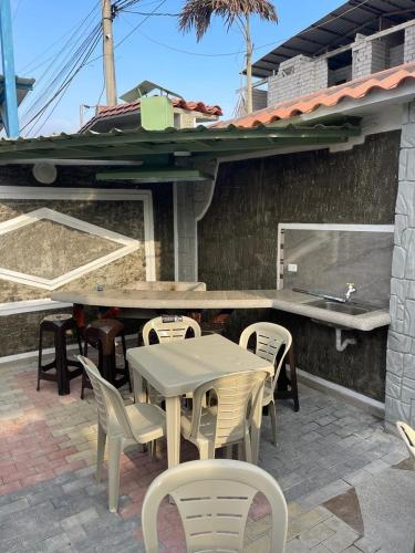 a table and chairs sitting on a patio at Casa Halley #6 con vista al mar in Playas
