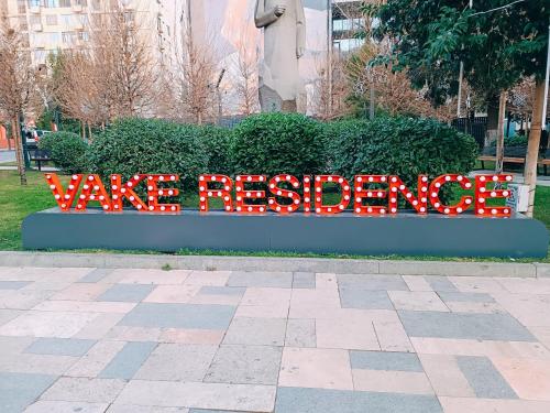 a sign that says wave reception in front of a bush at Vake Residence close to Park Mziuri in Tbilisi City