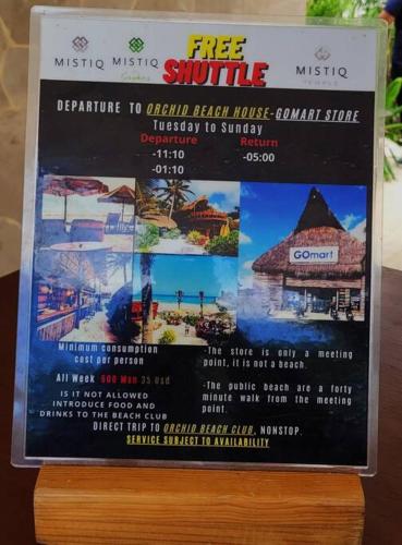 a sign for a free shuttle at a disney resort at Beautiful Jungle Loft, 7 Pools, Free Beach Shuttle in Tulum