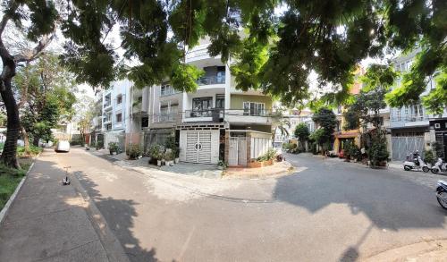 an empty street in front of a building at QV Home in Ho Chi Minh City