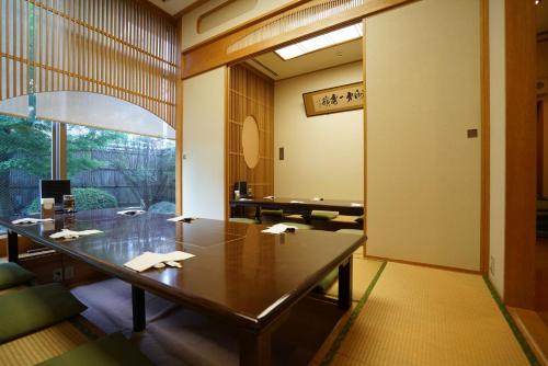 a conference room with a table and a window at Bellevue Garden Hotel Kansai International Airport in Izumi-Sano