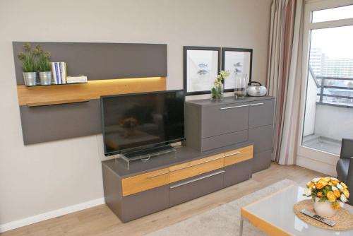 a living room with a large flat screen tv at Penthousewohnung mit Traumblick au in Damp