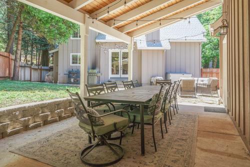 a patio with a wooden table and chairs on it at Yellowdog Inn in Arnold