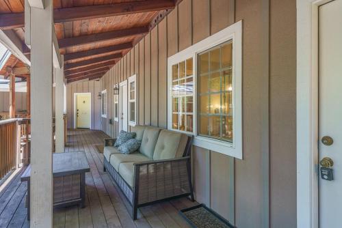 a porch with a couch and a table on a house at Yellowdog Inn in Arnold