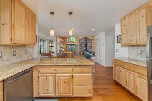 a kitchen with wooden cabinets and a large island at Sequoia Ridge in Dorrington