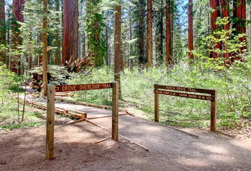 a sign for a trail in a forest at Sequoia Ridge in Dorrington