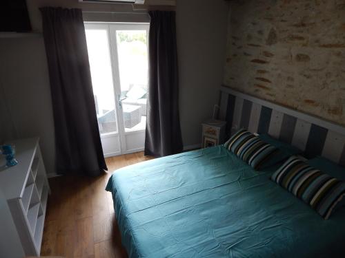 Postel nebo postele na pokoji v ubytování Chambre d'Hôtes le massanous