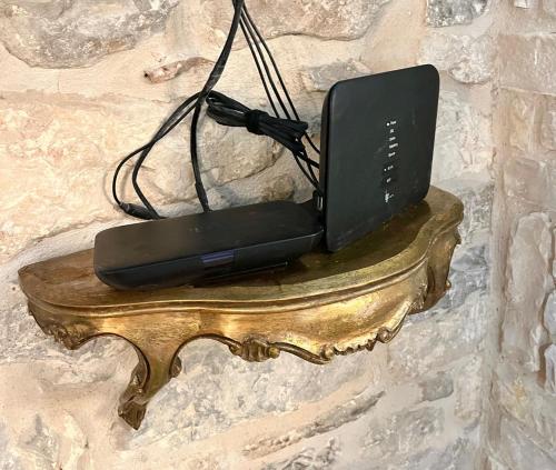 a laptop sitting on top of a stone wall at Apartment Venus of the Palace - NEW RENOVATED in Split