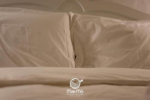 Ein Bett oder Betten in einem Zimmer der Unterkunft MareMò Accomodations - Rooms in Tropea