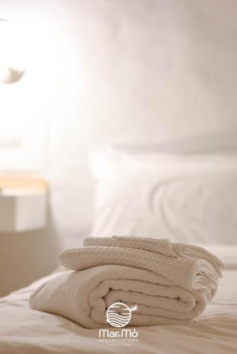 Ein Bett oder Betten in einem Zimmer der Unterkunft MareMò Accomodations - Rooms in Tropea