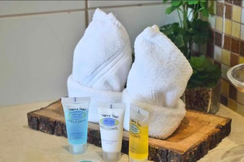 a group of three bottles of sunscreen on a table at Chic/Elegant 4 Bedrooms… in Jeddah