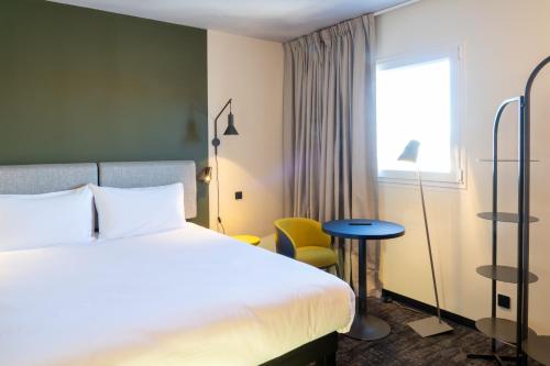 Postel nebo postele na pokoji v ubytování ibis Saint Paul Trois Chateaux