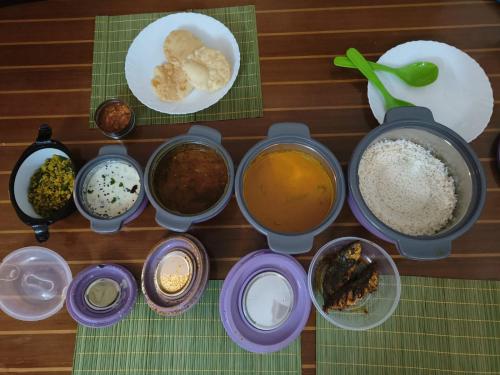 a table topped with different types of ingredients at Raaga on the Beach in Kannur