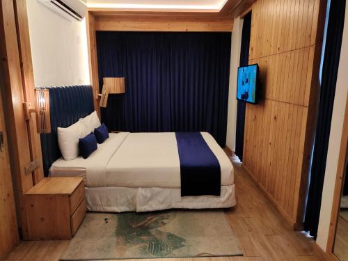 Cama o camas de una habitación en Grace Cox Smart Hotel