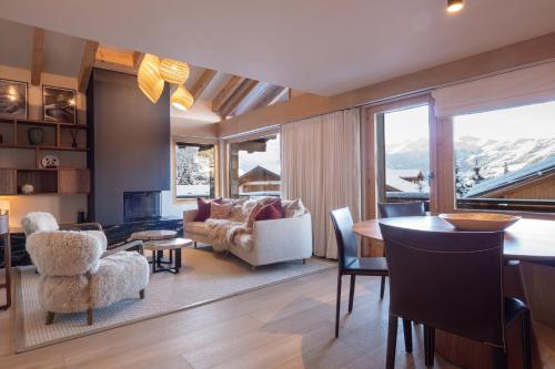 a living room with a couch and a table at La Ruinette- Stylish 4-bed, Centre Of Verbier in Verbier