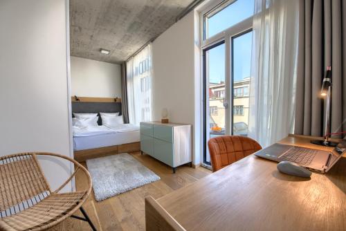 En eller flere senge i et værelse på Residence Soukenicka