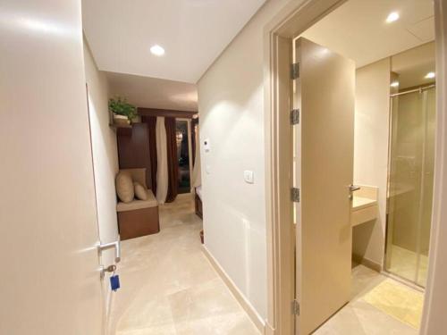 a hallway with a door leading into a room at Glamorous 2BR/ Free Beach & Pool Access @ Mangroovy, El Gouna in Hurghada