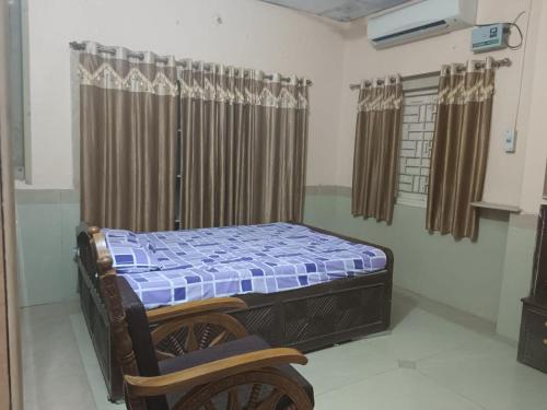 Säng eller sängar i ett rum på Ram Nivas Home Stay Dwarka