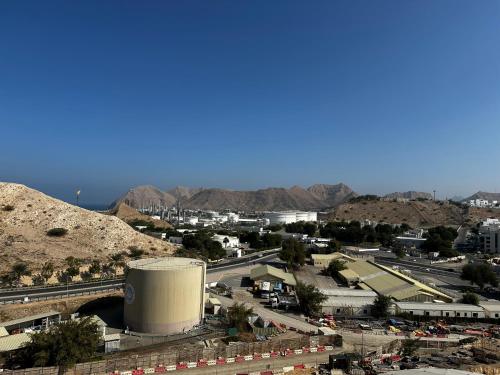 an aerial view of a city with a water tank at City Gem - Qurm in Muscat