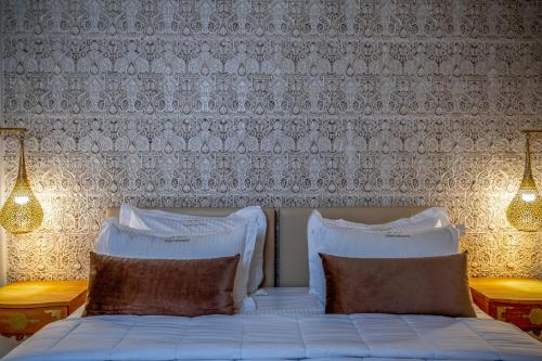 Un ou plusieurs lits dans un hébergement de l'établissement Riad Glatt K