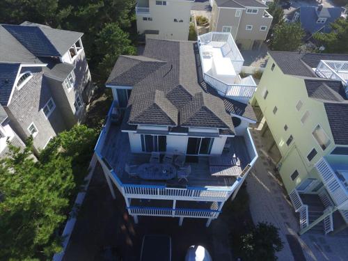 an overhead view of a house with blue at Close Walk To The Beach, The Perfect Home For A Single Family, in Harvey Cedars