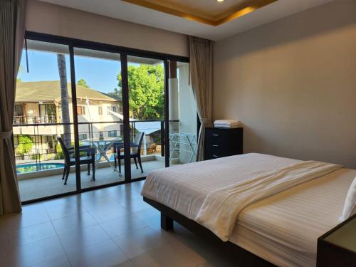 Postel nebo postele na pokoji v ubytování TSE Residence [by Samui Emerald]