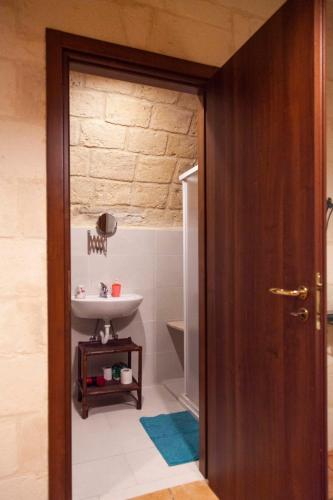 a bathroom with a sink and a toilet in it at Casa Vacanze Scolanova in Trani