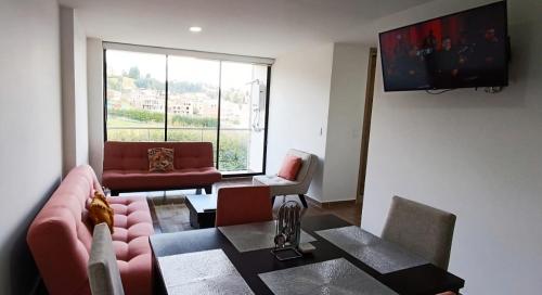 Μια τηλεόραση ή/και κέντρο ψυχαγωγίας στο Apartamento para descansar 3