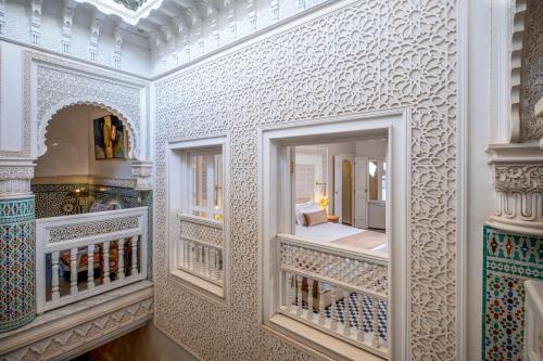 Un ou plusieurs lits dans un hébergement de l'établissement Riad Glatt K