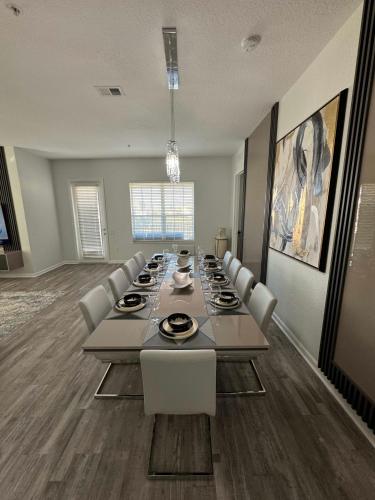 a large conference room with a long table and chairs at The Epic Milan Penthouse Orlando in Orlando