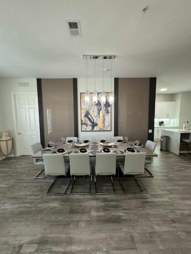 a large dining room with a table and chairs at The Epic Milan Penthouse Orlando in Orlando