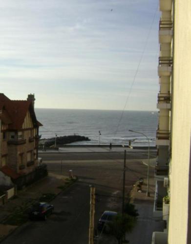 a view of the ocean from a window of a building at Hotel Rivamar in Mar del Plata