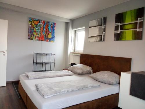 a bedroom with two beds and a window at MitZeit 2 -95qm inclusive Balkon in Augsburg