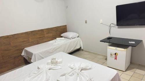 TV a/nebo společenská místnost v ubytování Suítes Tambaú