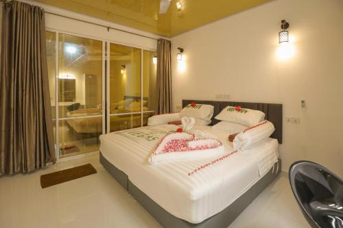 מיטה או מיטות בחדר ב-Vegas Thoddoo Maldives