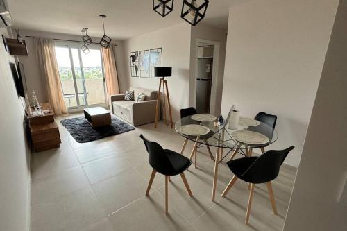 a living room with a glass table and chairs at Guesthouse Luxury in Cordoba